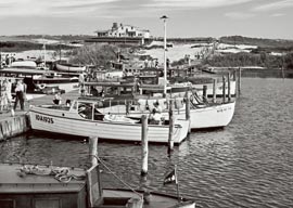 Old boats docked in the Fire Island marina, antighue photograph digitally restored and reprinted